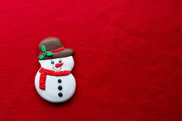 Christmas decoration mock up or flatlay with snowman over red background. Eco natural frame. winter, New Year Holidays concept as top view, copyspace. greeting card template