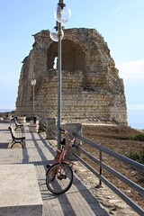 Italy, Salento, Torre dell'Orso: Foreshortening of old tower on the sea.