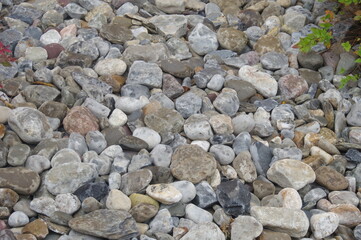 Background of Rounded Brown Beige Black River Rocks