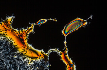 Extreme macro photograph of Vitamin C crystals forming abstract modern art patterns, when...
