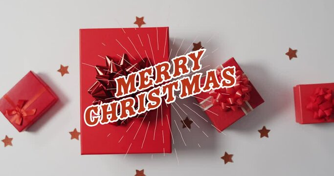 Animation of merry christmas text over presents