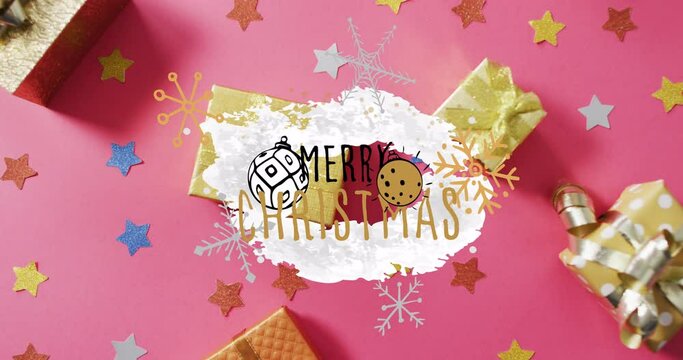 Animation of christmas text over christmas decoration and gifts