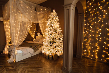magic warm and cozy evening in Christmas brown white room interior design, Xmas tree decorated lights garland holiday living room.canopy bed arch sofa mirror style New year holidays