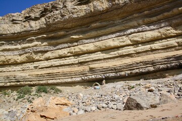 very old layers of a rock in mountain back to billions years