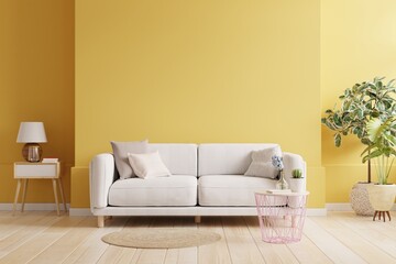 Yellow wall living room have sofa and decoration.