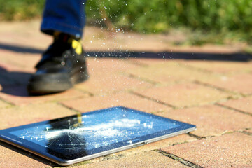 The child dropped the tablet and smashed the display on the tile