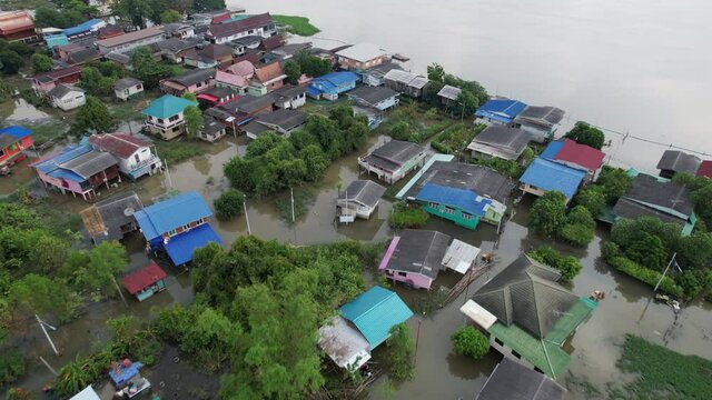 Aerial View of Houses Near Chao Phraya River Sunk Under the Water From Severe Flood in Pathum Thani Thailand