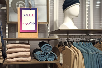 Sale -50% nameplate in a clothing store
