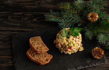 Traditional Russian New Year salad Olivier, New Year's or Christmas salad serving