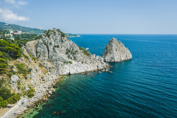 Fototapeta na wymiar Aerial view of Rock Diva. Beautiful black sea shore landscape with mountain cliff, main nature landmark in Crimean Simeiz on vacation