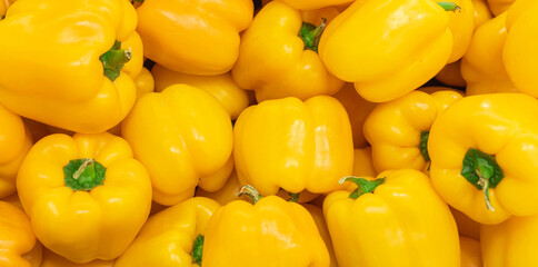 A lot of yellow pepper, texture background. Pile of fresh ripe yellow bell pepper pattern, high quality photo