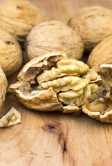 Crushed Walnut on the wood background. Close up.