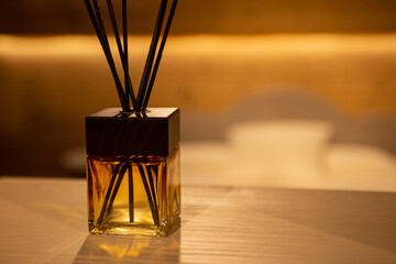 Fototapeta na wymiar square glass little perfume diffuser in modern interior