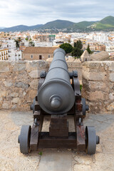 Fototapeta na wymiar Cannon on the fortress in Ibiza Town, Balearic Isnalds, Spain