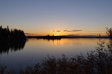 Fototapeta na wymiar A Colourful Sunset at Astotin Lake, Elk Island National Park