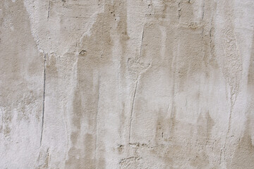 The texture of a gray concrete wall. The background of old cement plaster. Gray wall surface