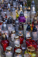 Memorial candle lights burning at the cemetery.