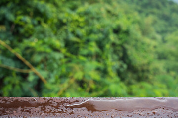 The water droplets on the steel beams formed by a recent rainstorm make crystal clear raindrops on...