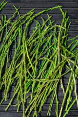 Grilled wild asparagus, seasonal spring harvest on a pan