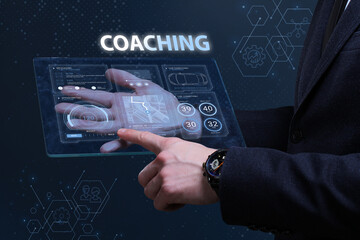 Business, Technology, Internet and network concept. Financial Graph. Stock Market chart. Young businessman working on a virtual screen of the future and sees the inscription: Coaching