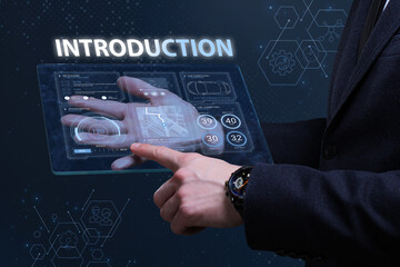 Business, Technology, Internet and network concept. Financial Graph. Stock Market chart. Young businessman working on a virtual screen of the future and sees the inscription: Introduction