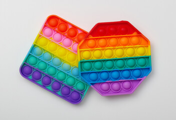 Toy pop it colorful and sensory rainbow isolated on white background.