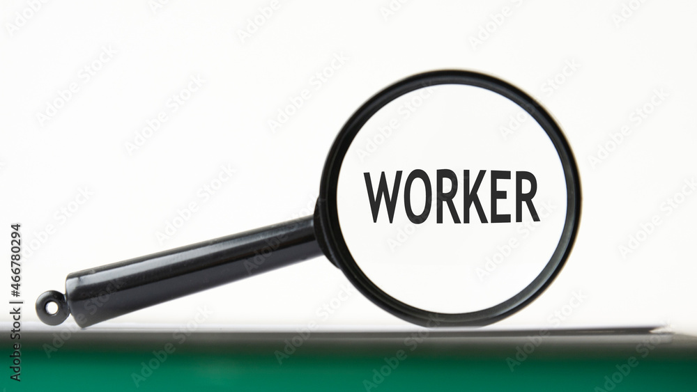 Poster magnifying glass with text worker on notebook