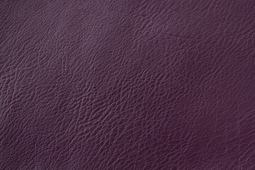 A piece of purple faux leather, rough texture. Can be used in the background