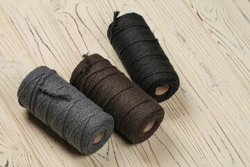 Three spools of cotton ropes of different colors. Handcraft.