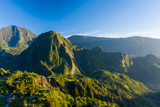 Aerial view of beautiful township among the mountains of Hell Bourg, Saint Benoit, Reunion.