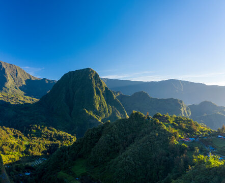 Aerial view of beautiful township among the mountains of Hell Bourg, Saint Benoit, Reunion.