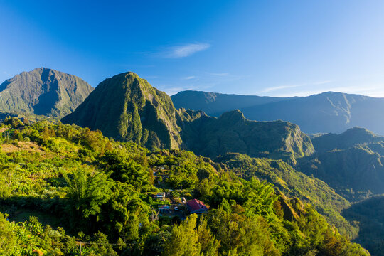 Aerial view of beautiful township among the mountains of Hell Bourg, Saint Benoit, Reunion.