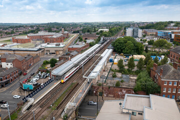 Obraz premium Aerial drone photo of the town centre of Wakefield in West Yorkshire in the UK showing a train in the main train station in the town centre