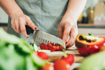 Close Up Photo of Woman Hands Cutting Fresh Vegetables at Kitchen Table