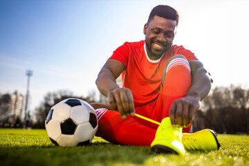 brazilian man goalkeeper catches the ball in the stadium during a football training