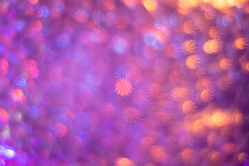 Abstract pink background with bokeh highlights in the form of the sun