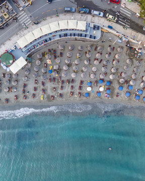 Aerial view of a small beach full of people in summertime in Ulcinj town in Eastern Europe, Balkans, Montenegro.