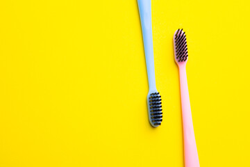 A toothbrush on a yellow background . Silicone toothbrush. Copy space. Yellow background. Dental care. Dentistry.