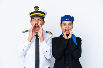 Airplane pilot and mixed race air hostess isolated on white background shouting and announcing...