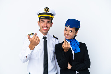 Airplane pilot and mixed race air hostess isolated on white background inviting to come with hand. Happy that you came