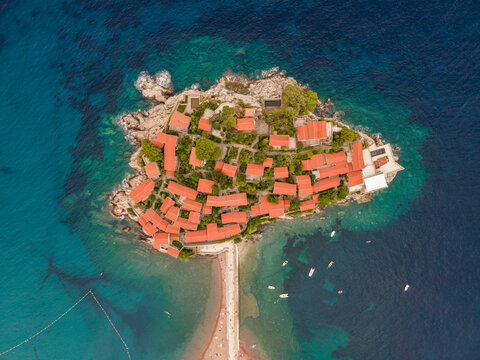 Aerial view of Sveti Stefan Peninsula, a small town in Mediterranean Sea in Balkans peninsula near Budva, Montenegro.