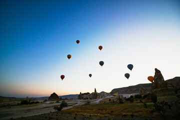 Fototapeta na wymiar Hot air balloons on the sky at sunrise in Cappadocia Turkey