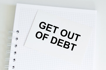Text get out of debt on the short note texture background