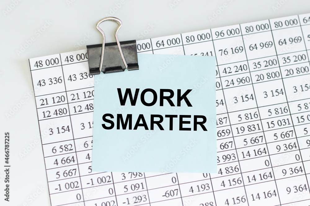Poster work smarter text on a blue card on the background of reports on the table