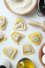 Concept of cooking ravioli on white background