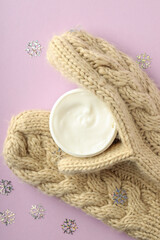 Composition with winter cosmetic on violet background