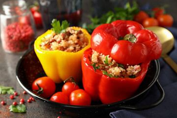 Concept of tasty food with stuffed pepper on dark textured background