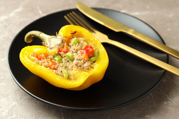 Concept of tasty food with stuffed pepper on gray textured background