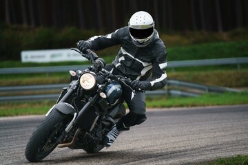 motorbike on the road riding. having fun driving the empty road on a motorcycle tour journey....