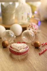 Various Christmas ornaments, candles and colorful bokeh lights. Selective focus.